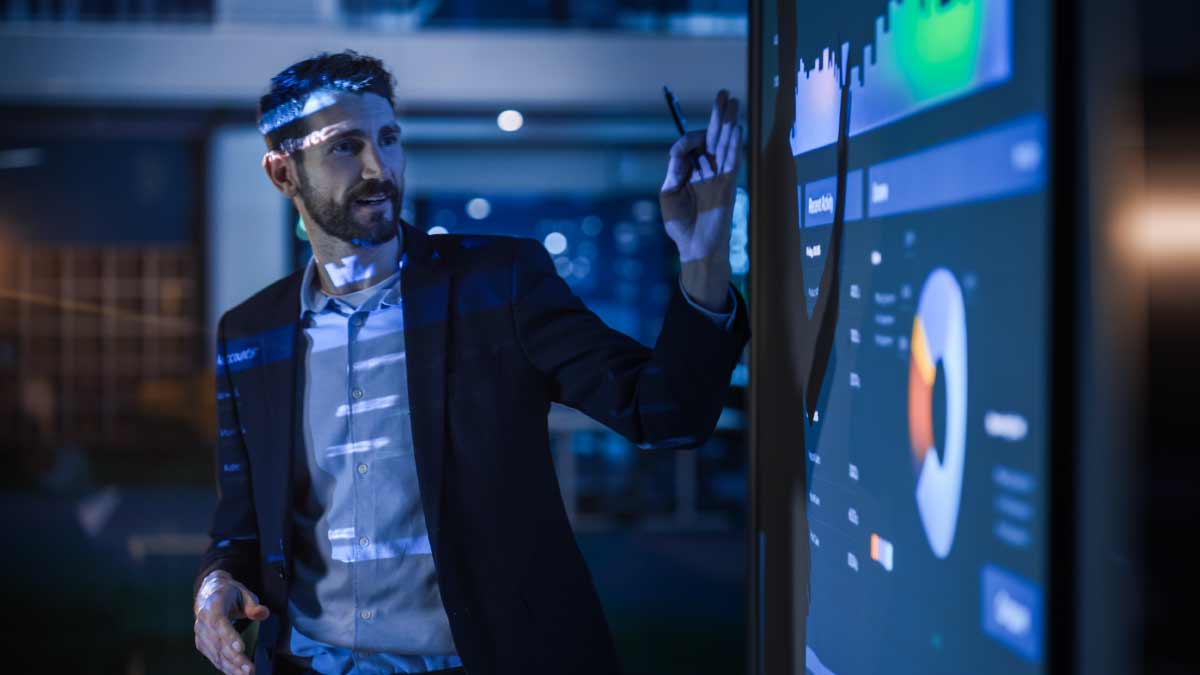 Person presenting performance data in office