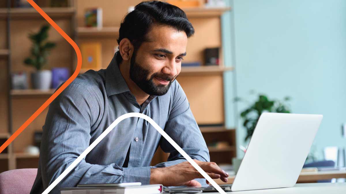 Person working on computer at desk in office
